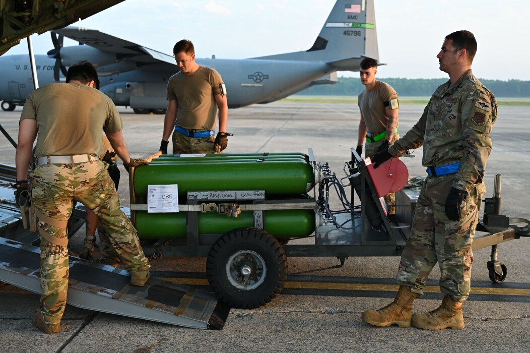 Airmen assigned to Little Rock Air Force Base load cargo onto a C-130J Super Hercules during Phase 1 of ROCKI 22-03