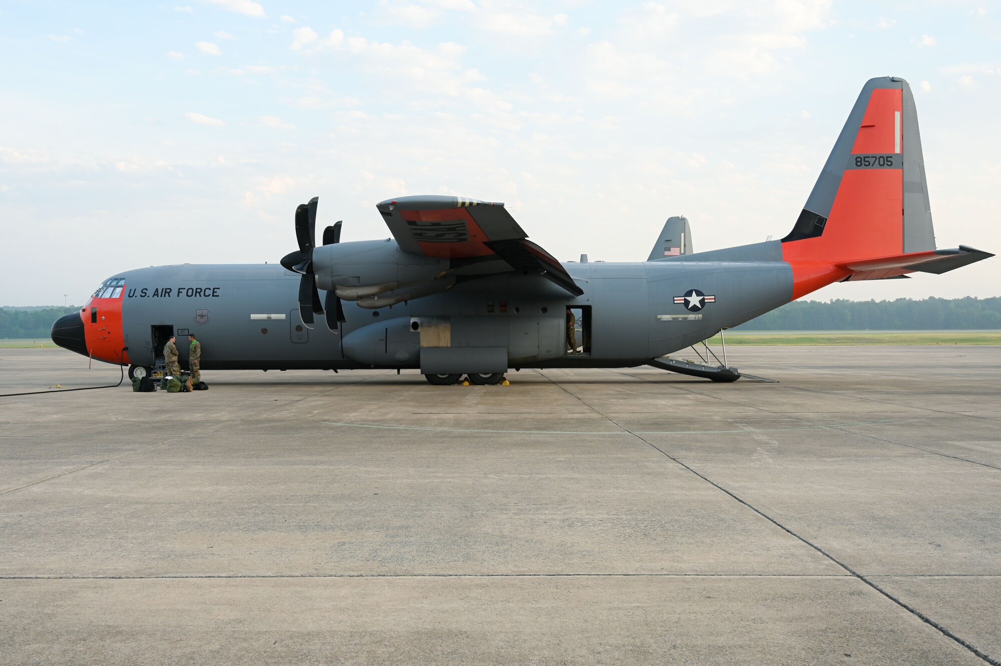 A C-130J Super Hercules is parked on the flightline