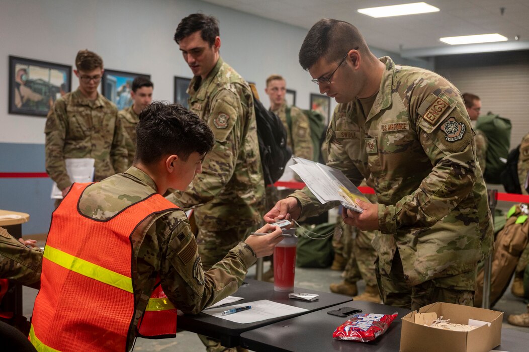 Tech. Sgt. Michael Swible, 19th Maintenance Group quality and assurance inspector, checks into the personnel deployment function line during Phase 1 of ROCKI 22-03
