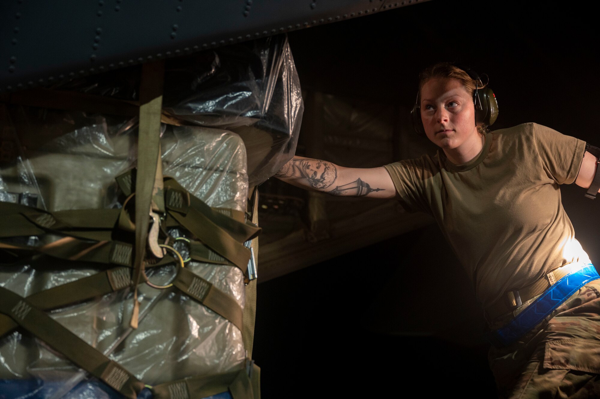 An Airman assigned to the 19th Airlift Wing load cargo onto a C-130J Super Hercules during Phase 1 of ROCKI 22-03