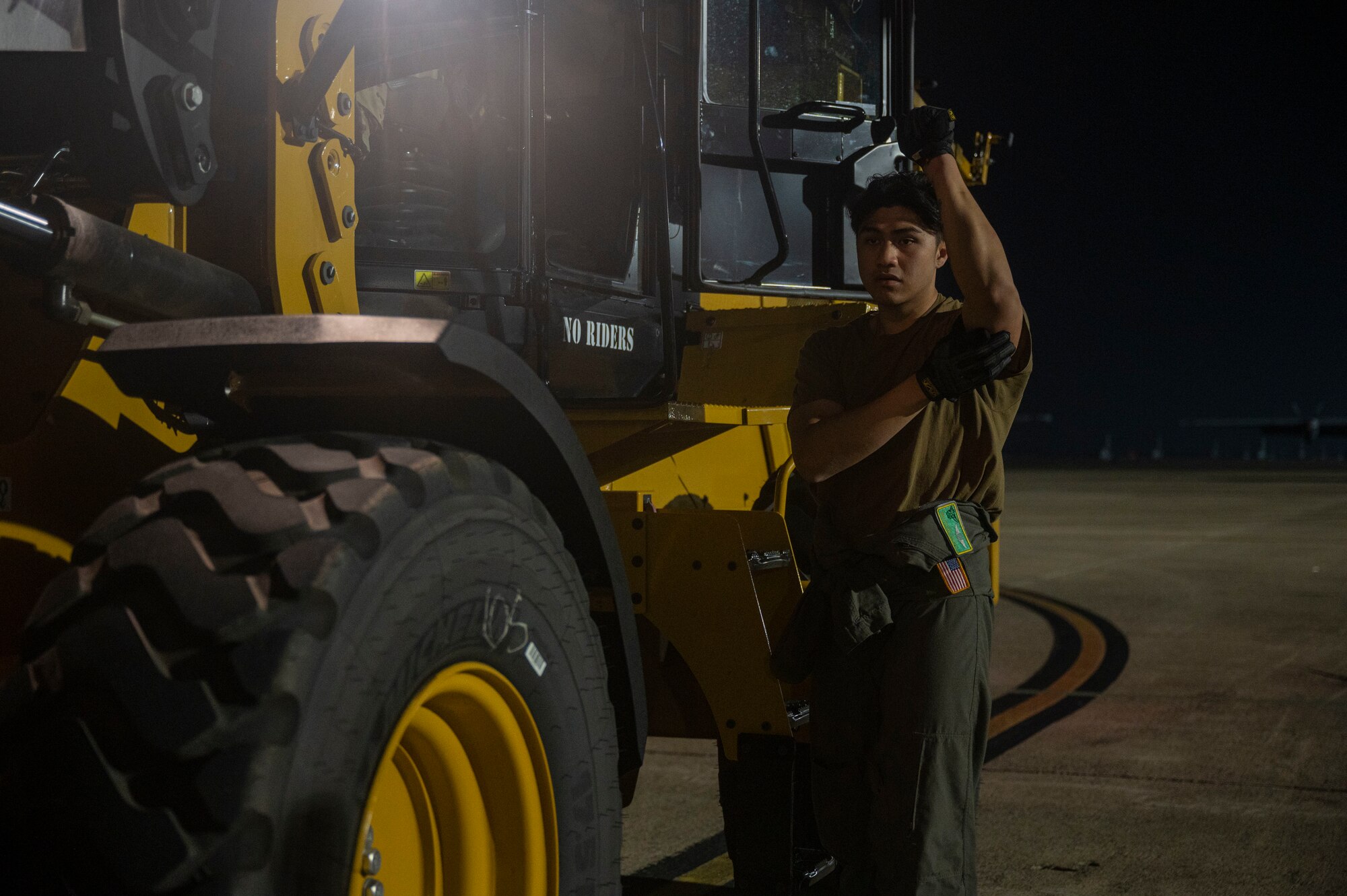 Senior Airman Klyde Calalo, 61st Airlift Squadron loadmaster, directs the on-loading of cargo onto a C-130J Super Hercules during Phase 1 of ROCKI 22-03