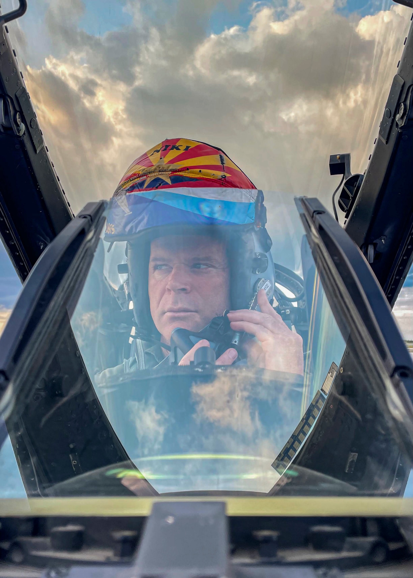 Lt. Col. Joost Luijsterburg, RNLAF detachment commander, Morris Air National Guard Base, Arizona, adjusts his oxygen mask before closing the aircraft canopy. Luijsterburg will close the Netherland’s time in Tucson before assuming command of the Dutch F-35 detachment at Luke Air Force Base, Arizona. (U.S. Air National Guard photo by Tech. Sgt. George Keck)