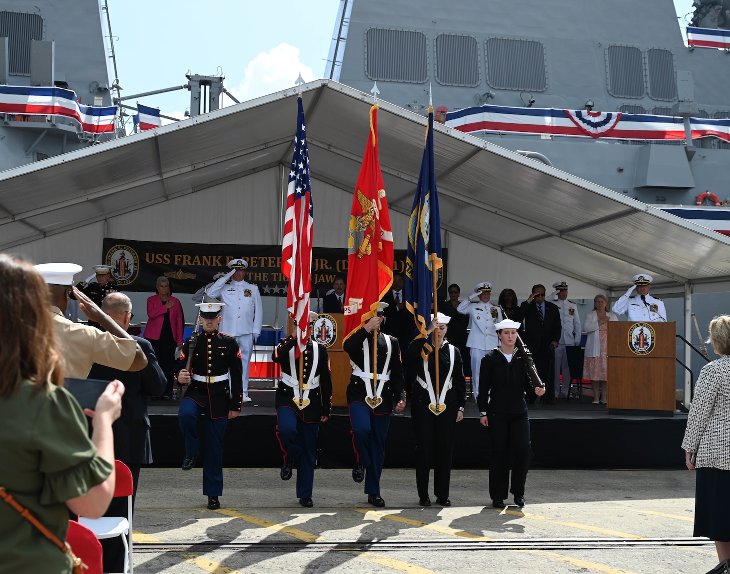 The color guard presents the colors during the commissioning of the Navy’s newest Arleigh Burke-class guided-missile destroyer USS Frank E. Petersen Jr. (DDG 121) in Charleston, S.C., May 14, 2022.