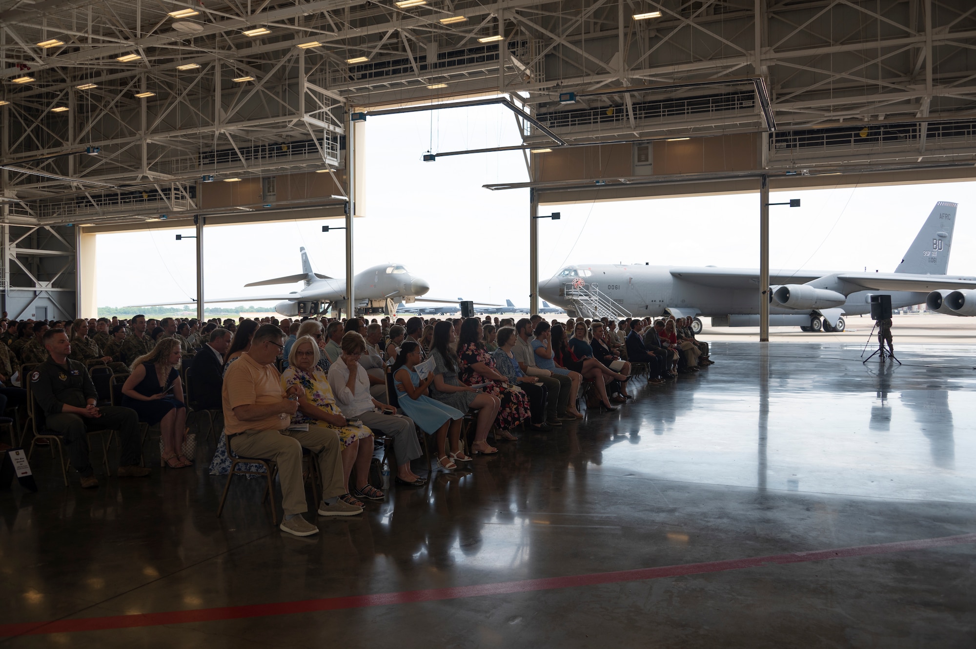 Audience sits in front of aircraft