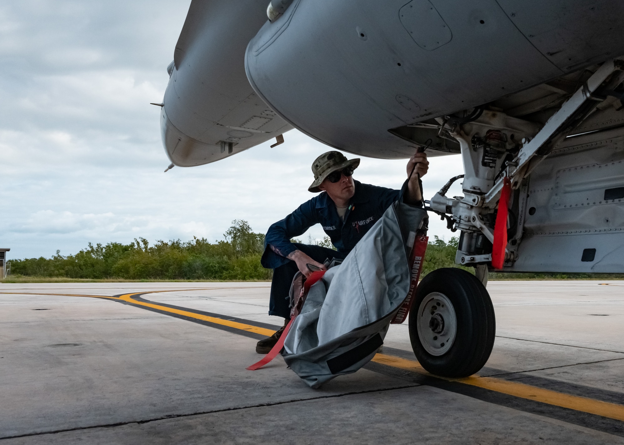 Maintenance Group crew chief breaks down his aircraft prior to the arrival of the pilot.