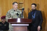 Maj. Gen. John Brennan, commander of Combined Joint Task Force – Operation Inherent Resolve, conducts a brief alongside an interpreter at the counter terrorism service conference in Baghdad, Iraq, May 9, 2022. The counter terrorism service conference is the first of its kind in which key leaders discuss enhanced joint planning, coordination and collaboration in the efforts of Iraqi and Peshmerga Special Operation Forces with a main focus of maintaining the defeat of terrorism. (U.S. Army photo by Staff Sgt. Bree-Ann Ramos-Clifton)