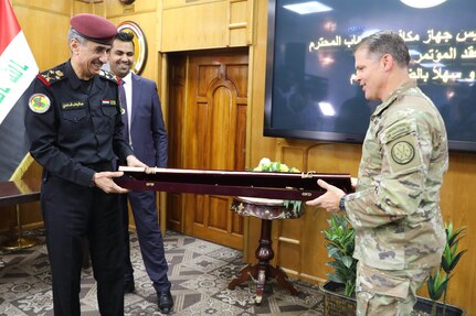 Staff Gen. Abdel Wahab al-Saadi, head of the Iraqi Counter-Terrorism Service, presents a gift to Maj. Gen. John Brennan, the commander of Combined Joint Task Force – Operation Inherent Resolve, at a counter-terrorism conference in Baghdad, Iraq, May 9, 2022. The counter-terrorism conference brought together key leaders from the Iraqi Ministry of the Interior, Iraqi Ministry of Defense and the Kurdistan Regional Government Ministry of Peshmerga to discuss enhancing joint planning, coordination and collaboration between all counter-terrorism elements in support of the shared goal of defeating terrorism. Leaders from the U.S.-led Coalition to defeat Daesh participated in the event as part of their mission to advise, assist and enable Partner Forces to ensure the enduring defeat of Daesh. (U.S. Army photo by Staff Sgt. Bree-Ann Ramos-Clifton)