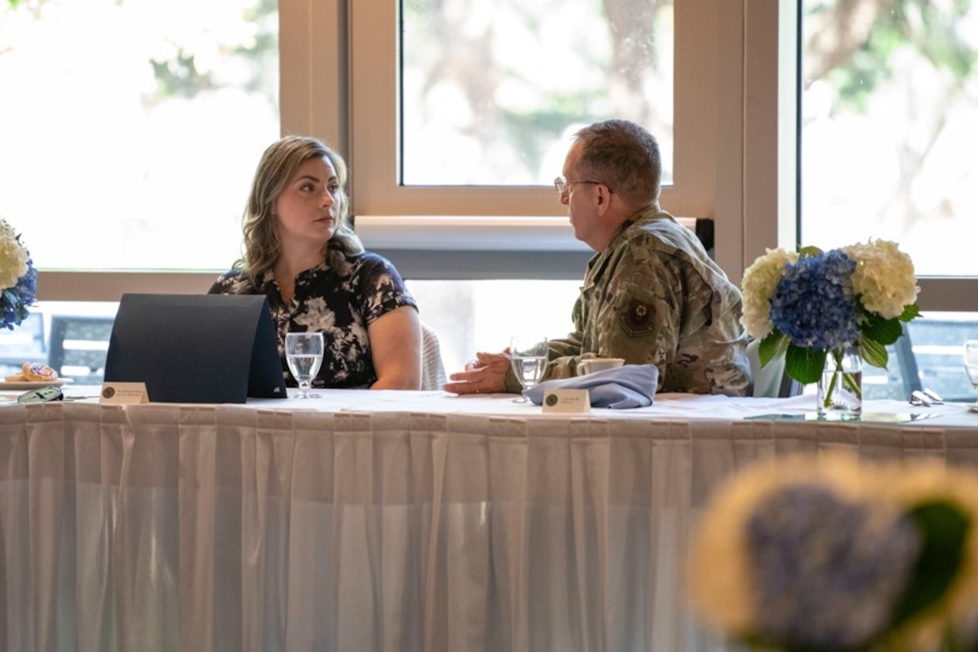 U.S. Air Force Lt. Gen. Jim Slife, commander of Air Force Special Operations Command, speaks with Katie-grace Young, operations intelligence team lead with the 11th Special Operations Intelligence Squadron, during the OAY Medallion breakfast at Hurlburt Field, Florida, May 11, 2022. In addition to the medallion breakfast, AFSOC formally recognized this year’s Outstanding Airmen of the Year award winners with a day of professional development events and a banquet (U.S. Air Force photo by Staff Sgt. Miranda Mahoney)