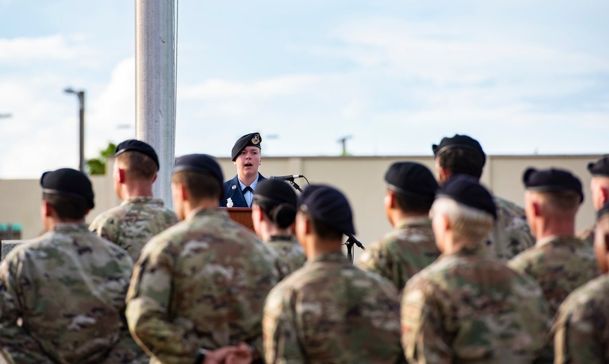 U.S. Air Force Staff Sgt. Katelynn Hagadorn, assigned to the 36th Mission Support Group, delivers remarks during an opening memorial ceremony for National Police Week May 16, 2022, at Andersen Air Force Base, Guam. National Police Week offers honor, remembrance and peer support while allowing law enforcement survivors and citizens to gather and pay homage to those who gave their life in the line of duty.(U.S. Air Force Photo by Senior Airman Helena Owens)