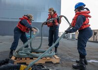 220514-N-TI693-1021

CIVITAVECCHIA, Italy (May 14, 2022) - Seaman Mabless Nazaire, left, from Tacoma, Washington, Seaman Najma Mohamoud, center, from Columbus, Ohio, and Seaman Jhayda Washington, from Philadelphia, stow a mooring line during a sea and anchor evolution aboard the Expeditionary Sea Base USS Hershel "Woody" Williams (ESB 4), May 14, 2022. Hershel "Woody" Williams is on a scheduled deployment in the U.S. Sixth Fleet area of operations in support of U.S. national interests and security in Europe and Africa. (U.S. Navy photo by Mass Communication Specialist 1st Class Fred Gray IV/Released)