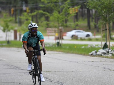 U.S. Army Cpl. Tiffanie Johnson rides an upright cycle in the cycling event during the U.S. Army Trials at Fort Bragg, North Carolina, May 7, 2022. Nearly 40 wounded, ill, and injured Soldiers are at Fort Bragg May 3 - 9 to compete in a series of athletic events including archery, cycling, shooting, sitting volleyball, swimming, powerlifting, track, field, rowing, and wheelchair basketball. The Army holds qualifying trials for active duty Soldiers and veterans to assess and select athletes for competition in the DoD Warrior Games. Active duty athletes compete in person at Army Trials to be assessed for selection, while veterans compete virtually and submit their results to the Army Recovery Care Program for assessment. This year, the DoD Warrior Games will take place in Orlando, Florida August 16 – 29, 2022.