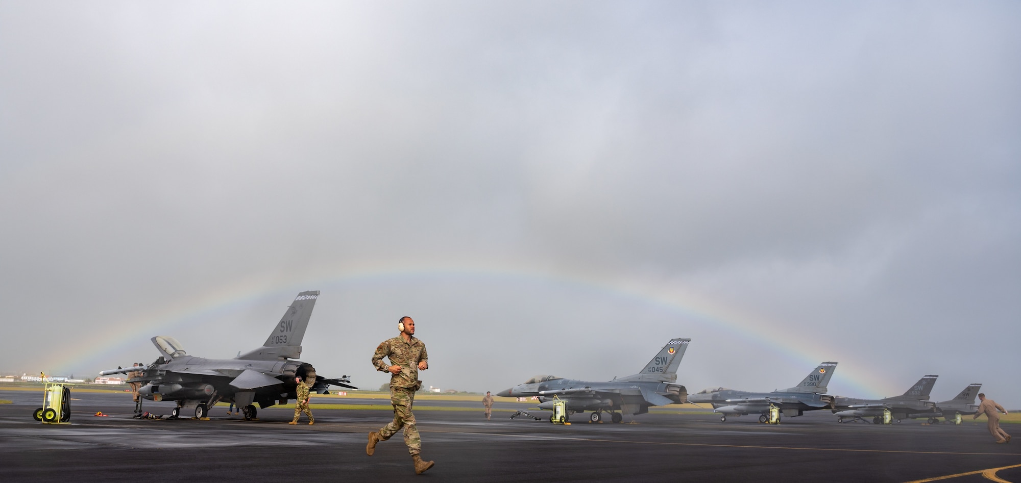 Airmen work with pilots to secure the launch of F-16 aircraft.