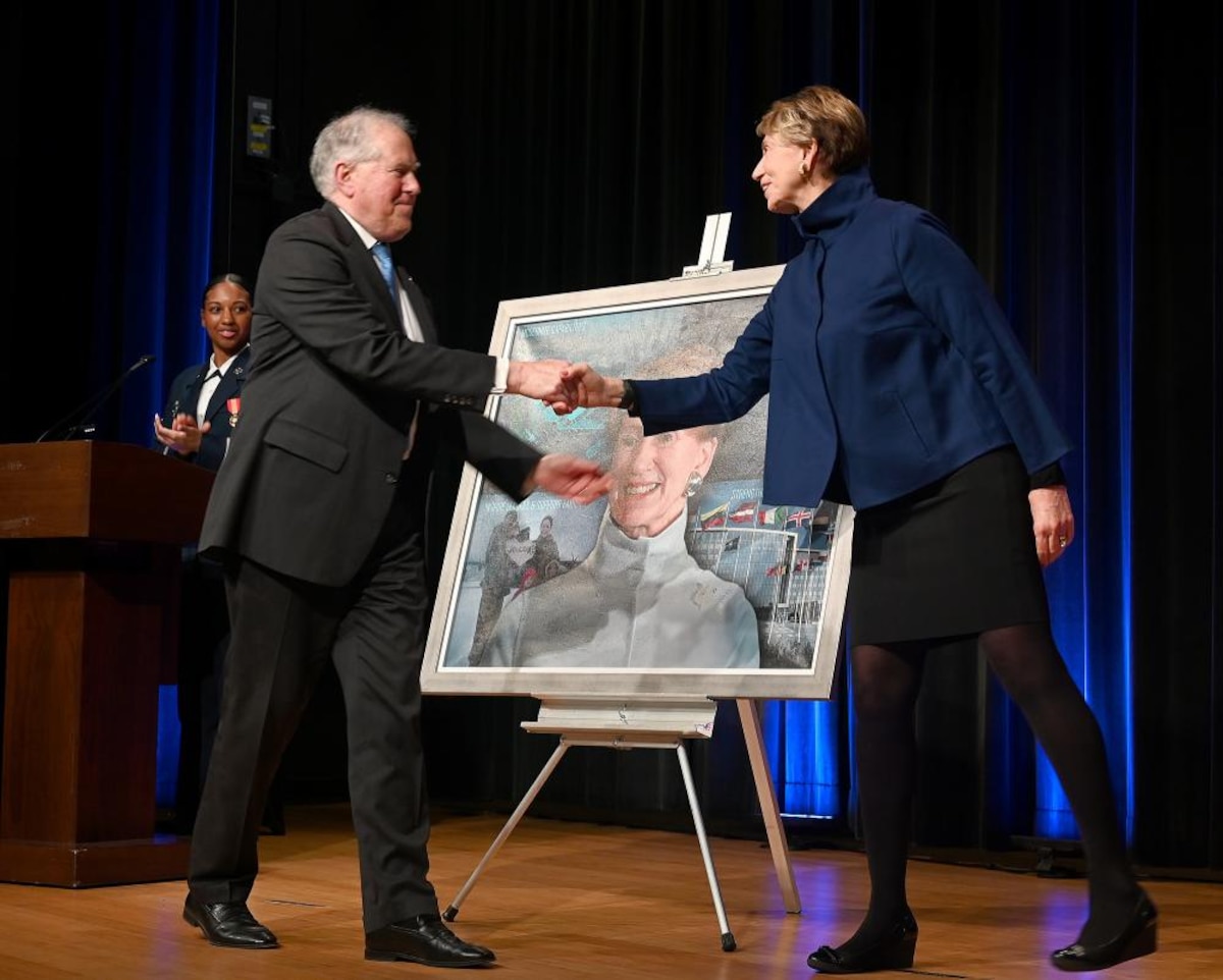 Secretary of the Air Force Frank Kendall shakes hands with former secretary Barbara Barrett after a portrait unveiling ceremony in Pentagon, Arlington, Va., May 13, 2022. The ceremony honored the unveiling of Barrett’s official portrait. (U.S. Air Force photo by Andy Morataya)