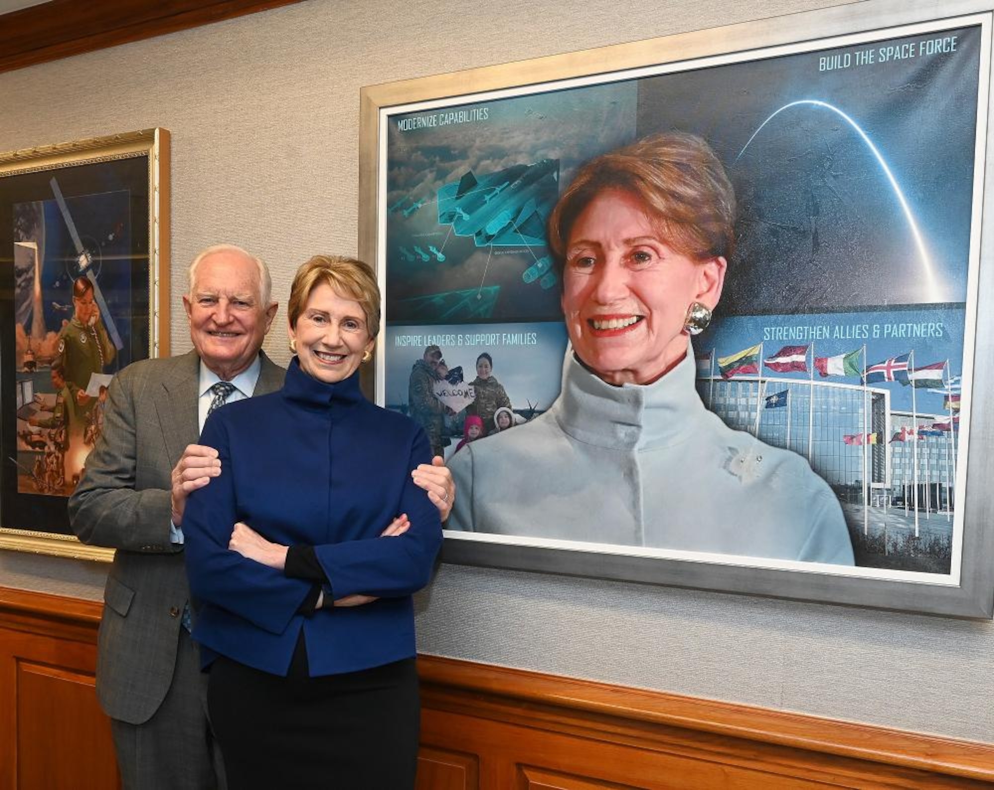 Former Secretary of the Air Force Barbara Barrett and her husband Craig pose next to her official portrait after the unveiling ceremony in the Pentagon, Arlington, Va., May 13, 2022. (U.S. Air Force photo by Andy Morataya)