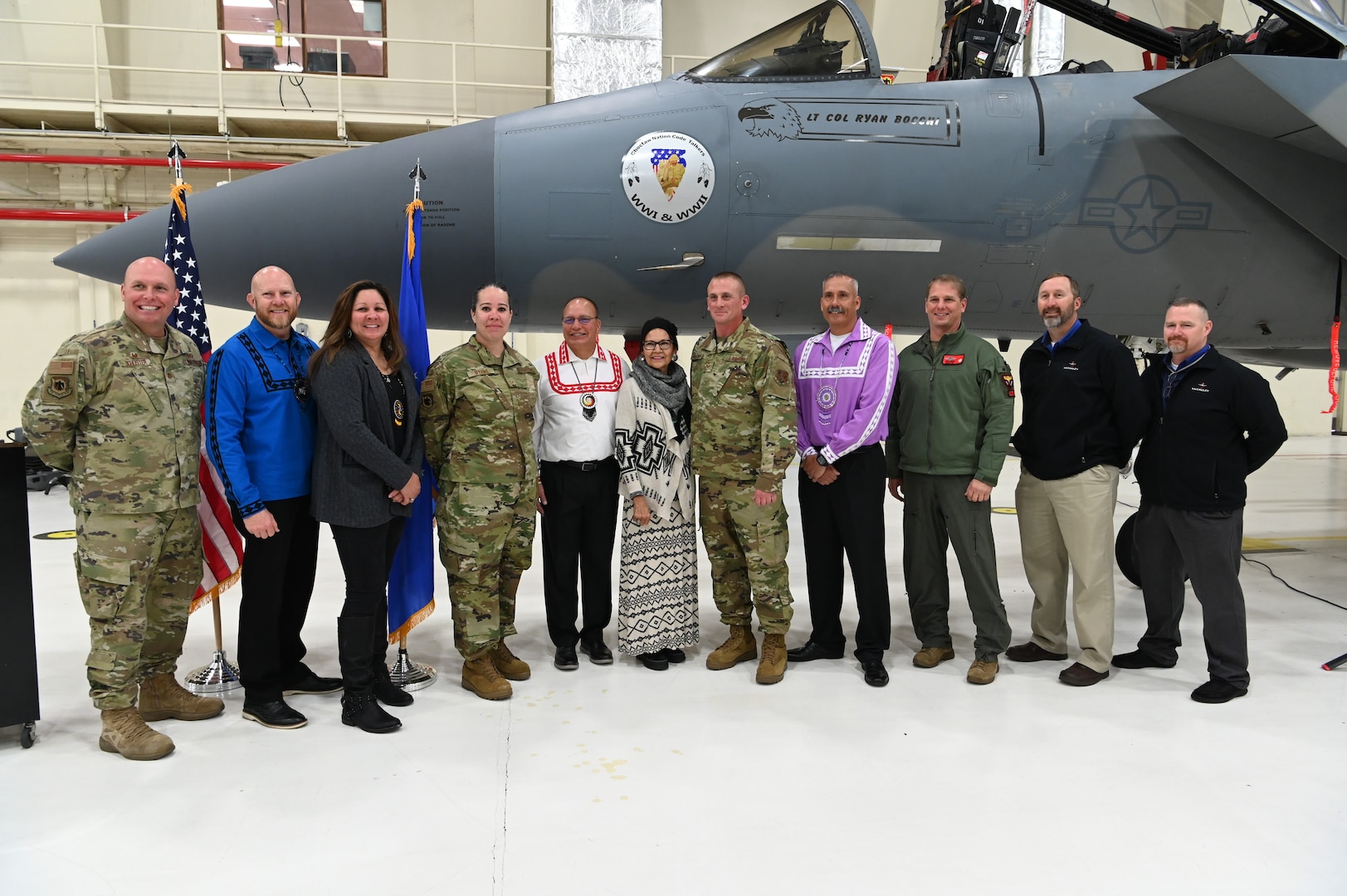 Members of the 173rd Fighter Wing and visiting dignitaries from the Choctaw Nation stand in front of the newly commissioned nose art, April 14, 2022, at Kingsley Field in Klamath Falls, Ore. Oregon Air National Guard Staff Sgt. Robert Holster, the dedicated crew chief, commissioned the artwork to pay homage to his lineage as a member of the Choctaw Tribe and his service to the U.S. military.