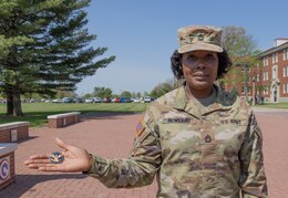 Soldier shows her President's Volunteer Service Coin