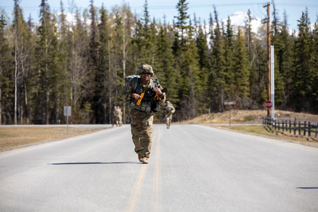 Alaska Army National Guard Spc. Eric Alvira-Ramos, with Headquarters and Headquarters Battery, 49th Missile Defense Battalion, participates in the 7.5-mile road march portion of the AKARNG’s Best Warrior Competition held at Joint Base Elmendorf-Richardson, Alaska, May 11, 2022. The six-day competition tests Soldiers’ mental and physical agility and toughness through a series of events that measure technical and tactical proficiency. (Alaska National Guard photo by 1st Lt. Balinda O’Neal)