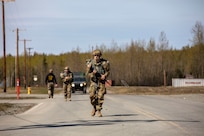 Alaska Army National Guard Pfc. Samuel Barnlund, with 207th Engineer Utilities Detachment, 297th Regional Support Group, participates in the 7.5-mile road march portion of the AKARNG’s Best Warrior Competition held at Joint Base Elmendorf-Richardson, Alaska, May 11, 2022. The six-day competition tests Soldiers’ mental and physical agility and toughness through a series of events that measure technical and tactical proficiency. (Alaska National Guard photo by 1st Lt. Balinda O’Neal)