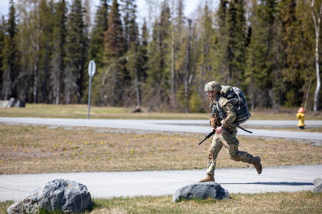 Alaska Army National Guard Spc. Nicholas Hanks, with Alpha Company, 49th Missile Defense Battalion, participates in the 7.5-mile road march portion of the AKARNG’s Best Warrior Competition held at Joint Base Elmendorf-Richardson, Alaska, May 11, 2022. The six-day competition tests Soldiers’ mental and physical agility and toughness through a series of events that measure technical and tactical proficiency. (Alaska National Guard photo by 1st Lt. Balinda O’Neal)