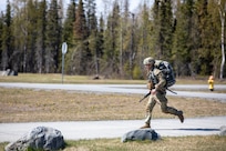 Alaska Army National Guard Spc. Nicholas Hanks, with Alpha Company, 49th Missile Defense Battalion, participates in the 7.5-mile road march portion of the AKARNG’s Best Warrior Competition held at Joint Base Elmendorf-Richardson, Alaska, May 11, 2022. The six-day competition tests Soldiers’ mental and physical agility and toughness through a series of events that measure technical and tactical proficiency. (Alaska National Guard photo by 1st Lt. Balinda O’Neal)