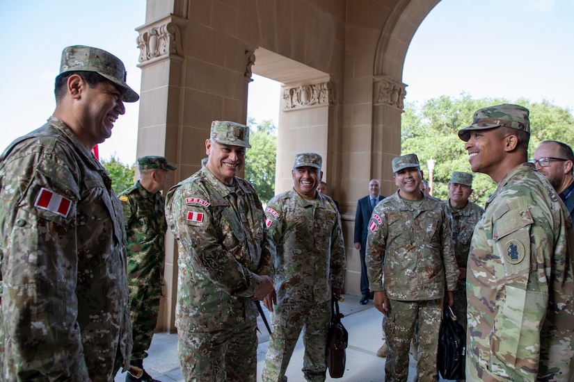 The U.S. Army South Commanding General Maj. Gen. William L. Thigpen, right, greets a Peruvian Army delegation at U.S. Army South headquarters, Fort Sam Houston, Texas, May 16, prior to beginning the 7th annual Peru-U.S. Army-to-Army Staff Talks. The Army Staff Talks Program seeks to promote bilateral efforts in order to develop professional partnerships and increase interaction between partner nation armies.