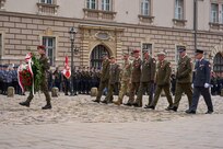 KRAKOW, Poland - Col. John Sandor, acting chief of staff, Defender-Europe 22 combined higher command, V Corps, and members of the Polish military take part in a wreath laying ceremony at the Cross of Katyn in Krakow, Poland, May 3, 2022. The wreath laying is part of the annual Constitution Day celebrations in Krakow. Constitution Day, a Polish holiday, is a celebration of the declaration of the Polish constitution on May 3, 1791. (U.S. Army photo by Sgt. Sean Hall)