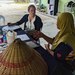 Capt. Samantha Warner discusses food safety processes with the owner of a Malaysian catering facility as part of Keris Strike 2022.(Photo taken by Capt. Samantha Warner)