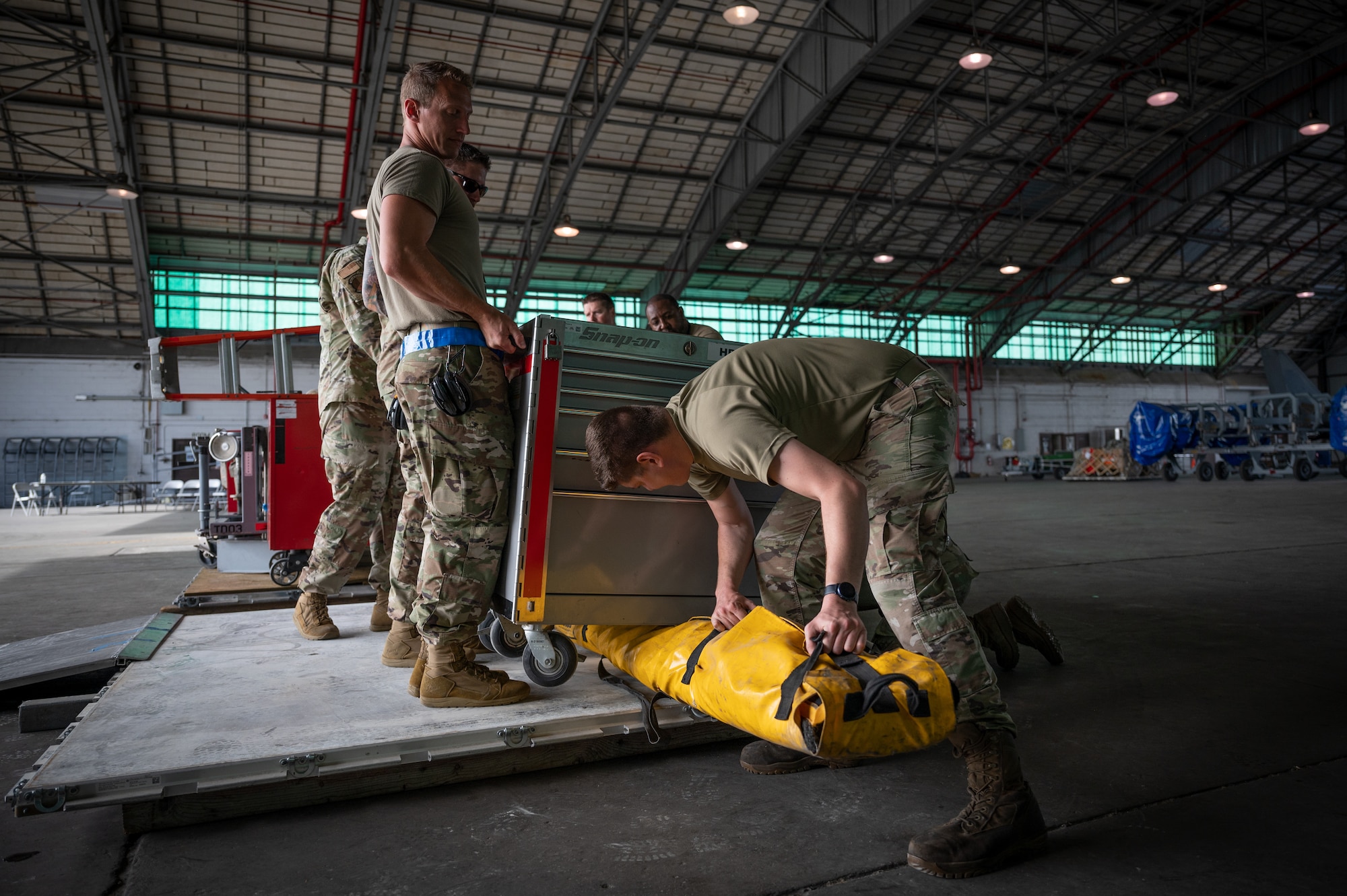 Reservists from the 419th Fighter Wing load a pallet at the Air Dominance Center in preparation for the close of Sentry Savannah.