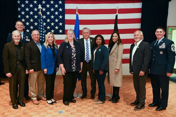 people posing for a photo outside