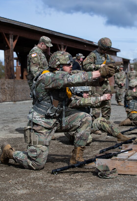 Alaska Army National Guardsman Spc. Mark Adair with the 207th Engineer Utilities Detachment, fires a M17 handgun during marksmanship event as a part of the Alaska Army National Guard Best Warrior Competition on Joint Base Elmendorf-Richardson, AK, May 14, 2022. The Best Warrior Competition recognizes Soldiers who demonstrate commitment to the Army values and embody the warrior ethos. (U.S. Army National Guard photo by Spc. Marc Marmeto).