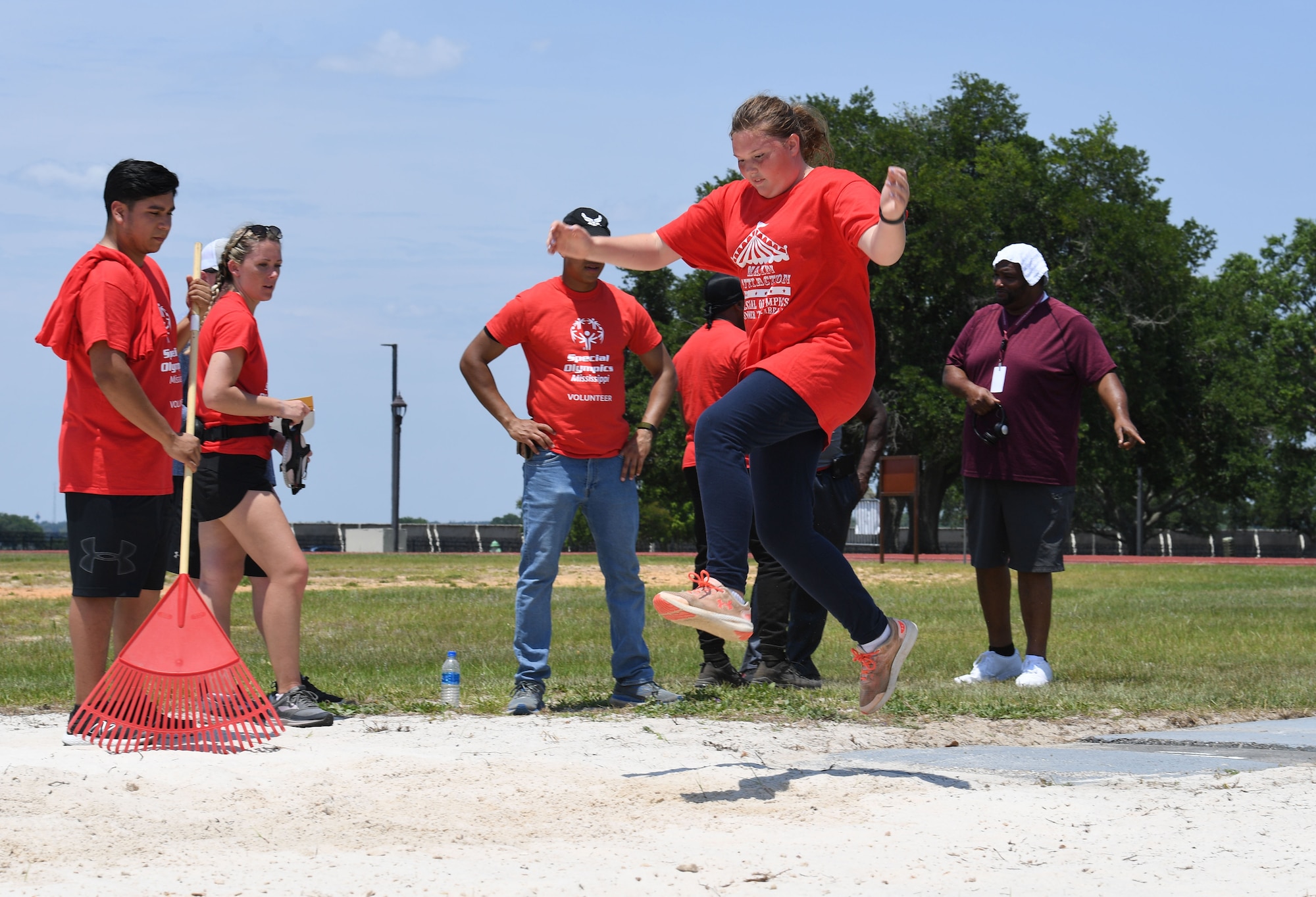 Erica Allred, Area 11 athlete, participates in running long jump, during the Special Olympics Mississippi Summer Games at Keesler Air Force Base, Miss., May 14, 2022. Over 600 athletes participated in the Summer Games. (U.S. Air Force photo by Kemberly Groue)