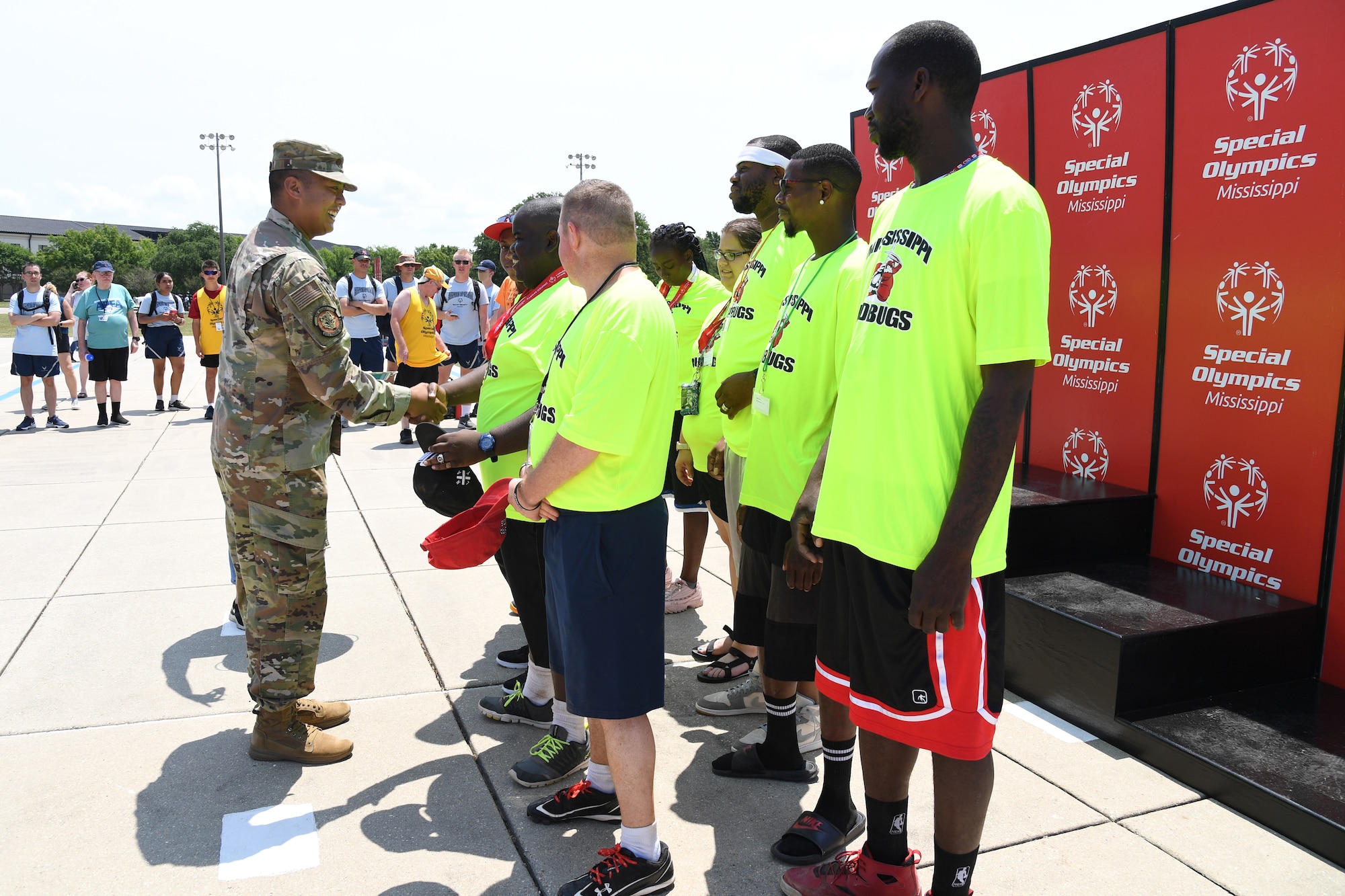 U.S. Air Force Maj. Marc Icban, 336th Training Squadron deputy commander, presents medals to the Mississippi Mud Bugs softball team during the Special Olympics Mississippi Summer Games at Keesler Air Force Base, Miss., May 14, 2022. Over 600 athletes participated in the Summer Games. (U.S. Air Force photo by Kemberly Groue)