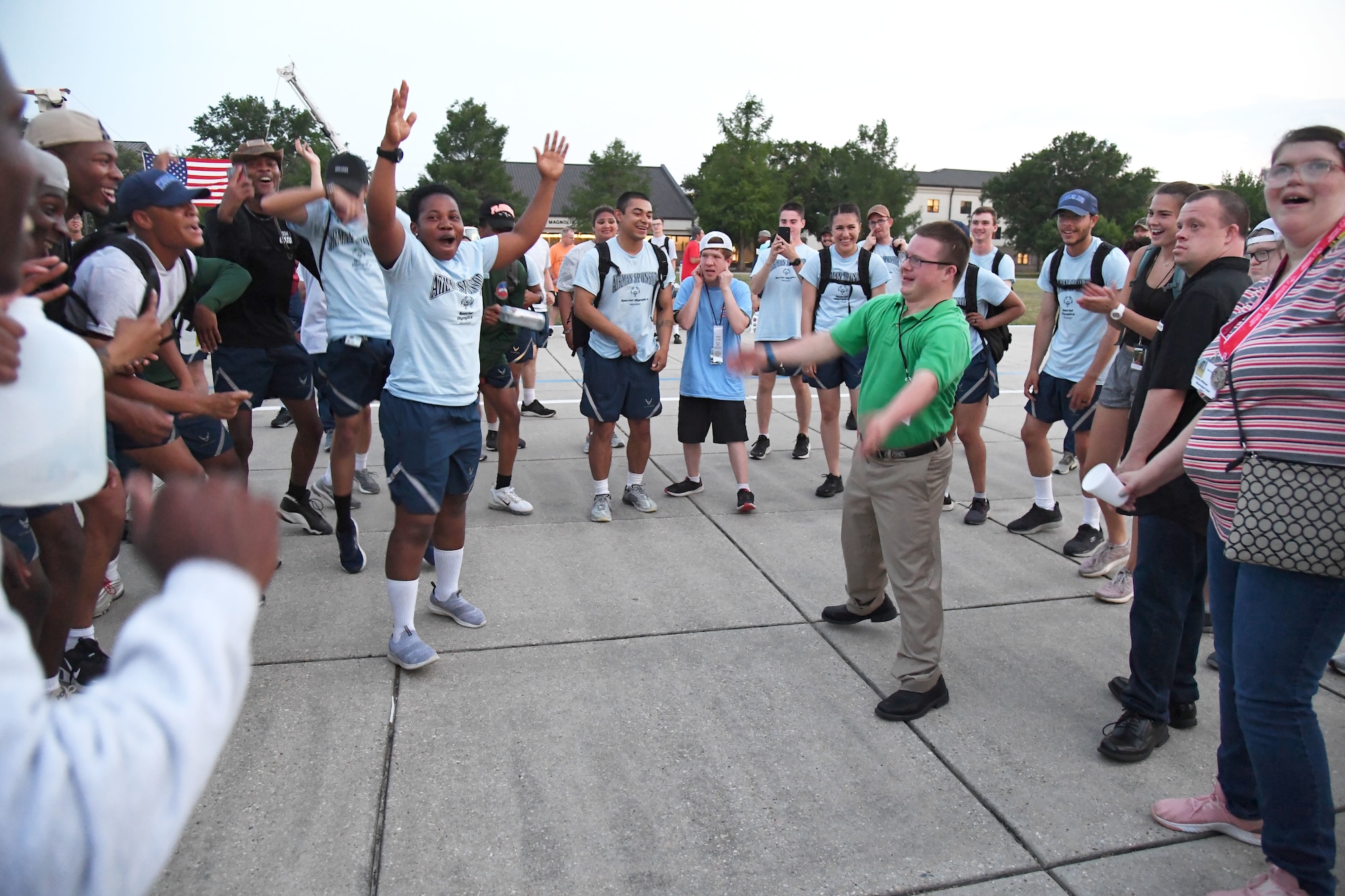 Athletes and their Airman sponsors dance during the closing ceremonies of Special Olympics Mississippi Summer Games at Keesler Air Force Base, Miss., May 14, 2022. Over 600 athletes participated in the Summer Games. (U.S. Air Force photo by Kemberly Groue)