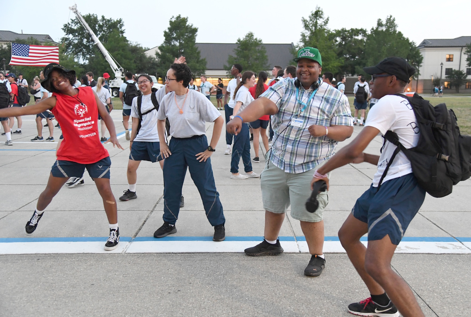 Athletes and their Airman sponsors dance during the closing ceremonies of Special Olympics Mississippi Summer Games at Keesler Air Force Base, Miss., May 14, 2022. Over 600 athletes participated in the Summer Games. (U.S. Air Force photo by Kemberly Groue)