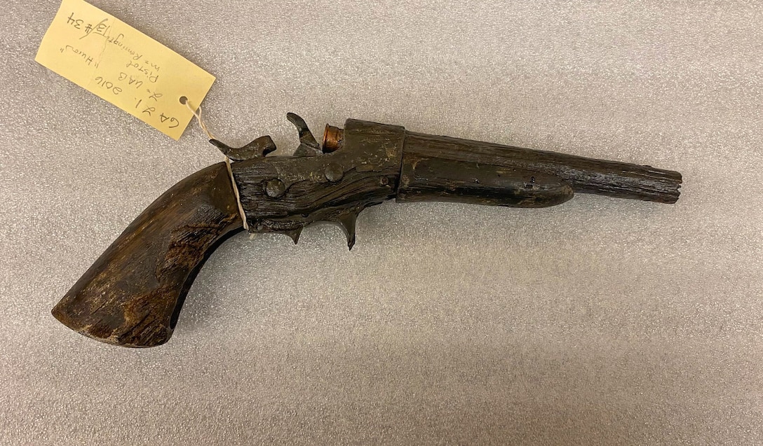 A Remington Rolling Block pistol was recovered from wreckage of the USS Huron, located off the coast of North Carolina. The Naval History and Heritage Command (NHHC) Underwater Archeology (UA) Branch requested support in making the artifact safe from Marine Corps Air Station (MCAS) Cherry Point’s Explosive Ordnance Disposal technicians. (Photo courtesy of NHHC UA Branch)