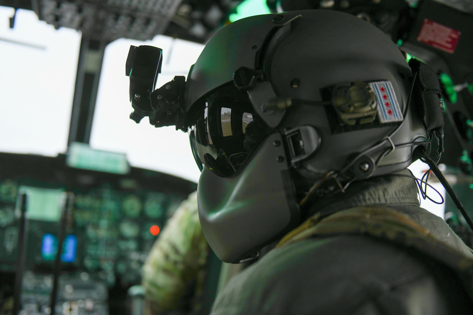 A U.S. Air Force flight engineer sits in a UH-1N Huey helicopter for a demonstration during Skyfest 2022 at Fairchild Air Force Base, Washington, May 14, 2022. Fairchild Skyfest 2022 offered a unique view of Team Fairchild's role in enabling Rapid Global Mobility for the U.S. Air Force. (U.S. Air Force photo by Airman 1st Class Jenna Bond)