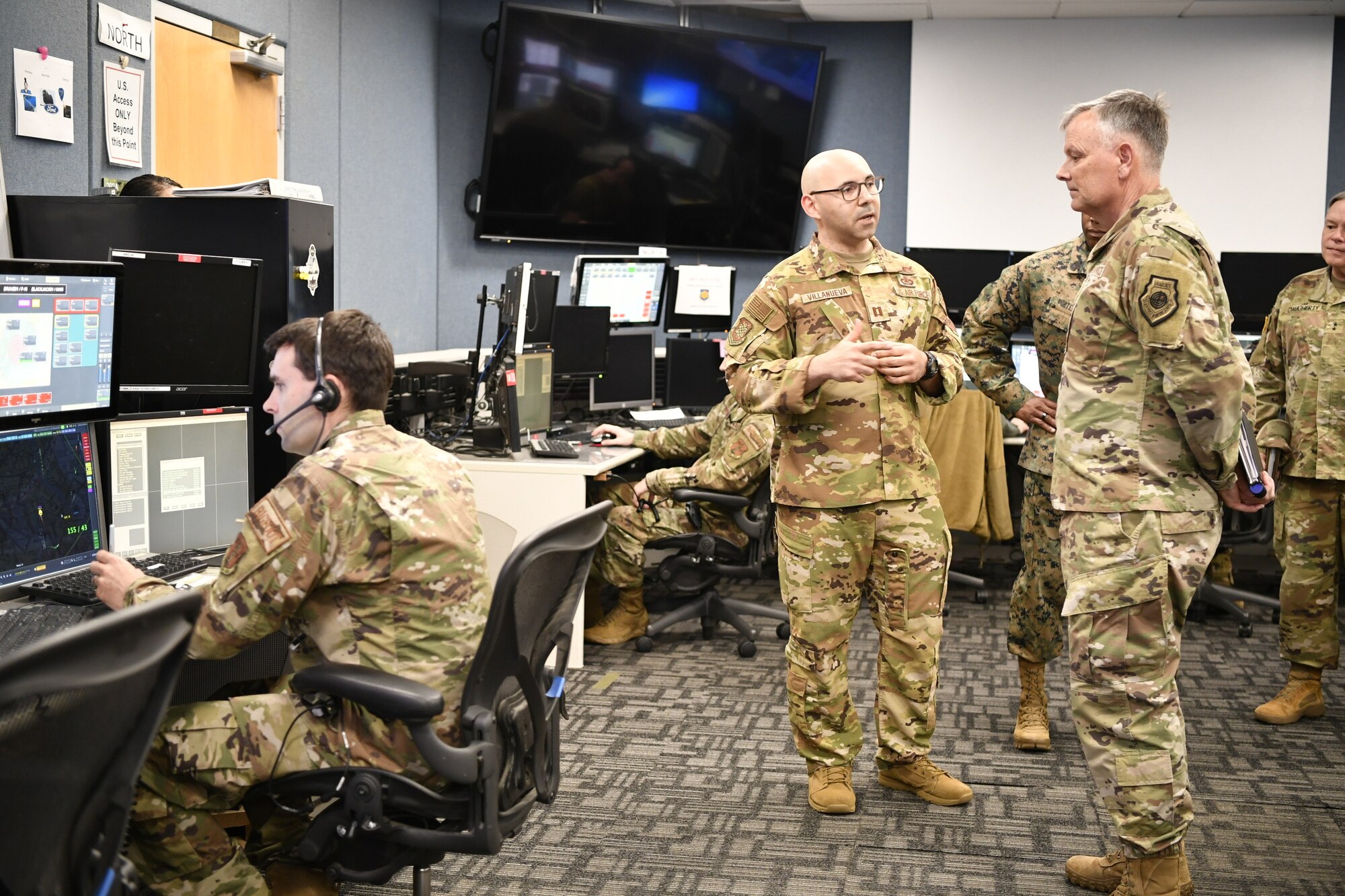 VanHerck receiving a briefing on the operations floor.