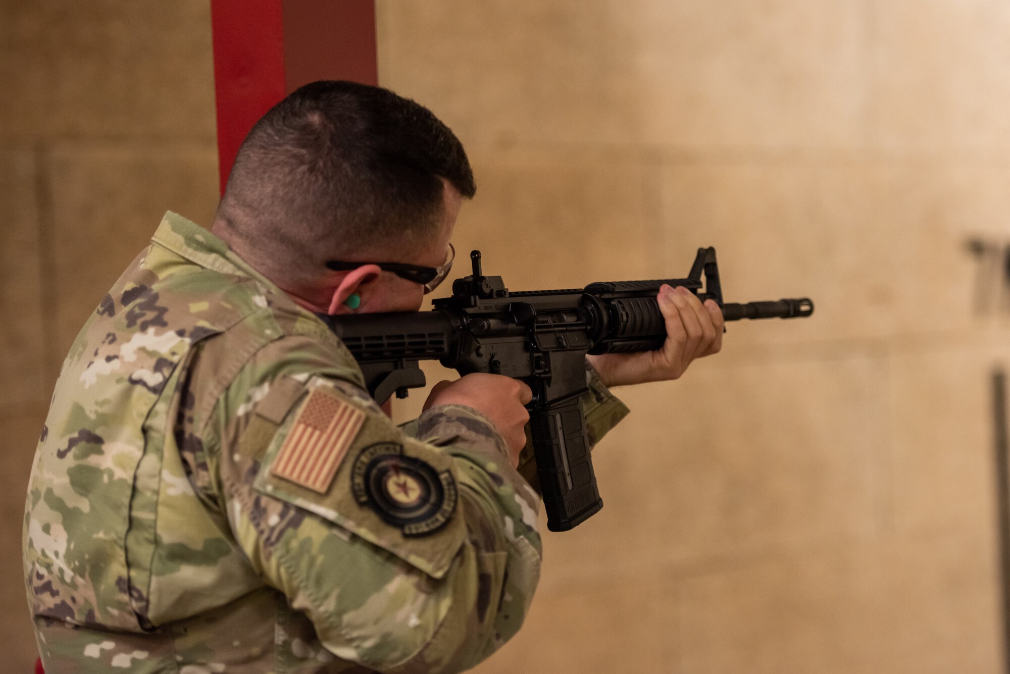 Staff Sgt. William Marshall, 51st Logistics Readiness Squadron fuels lab supervisor, fires during the M4 rifle portion of the excellence in competition event