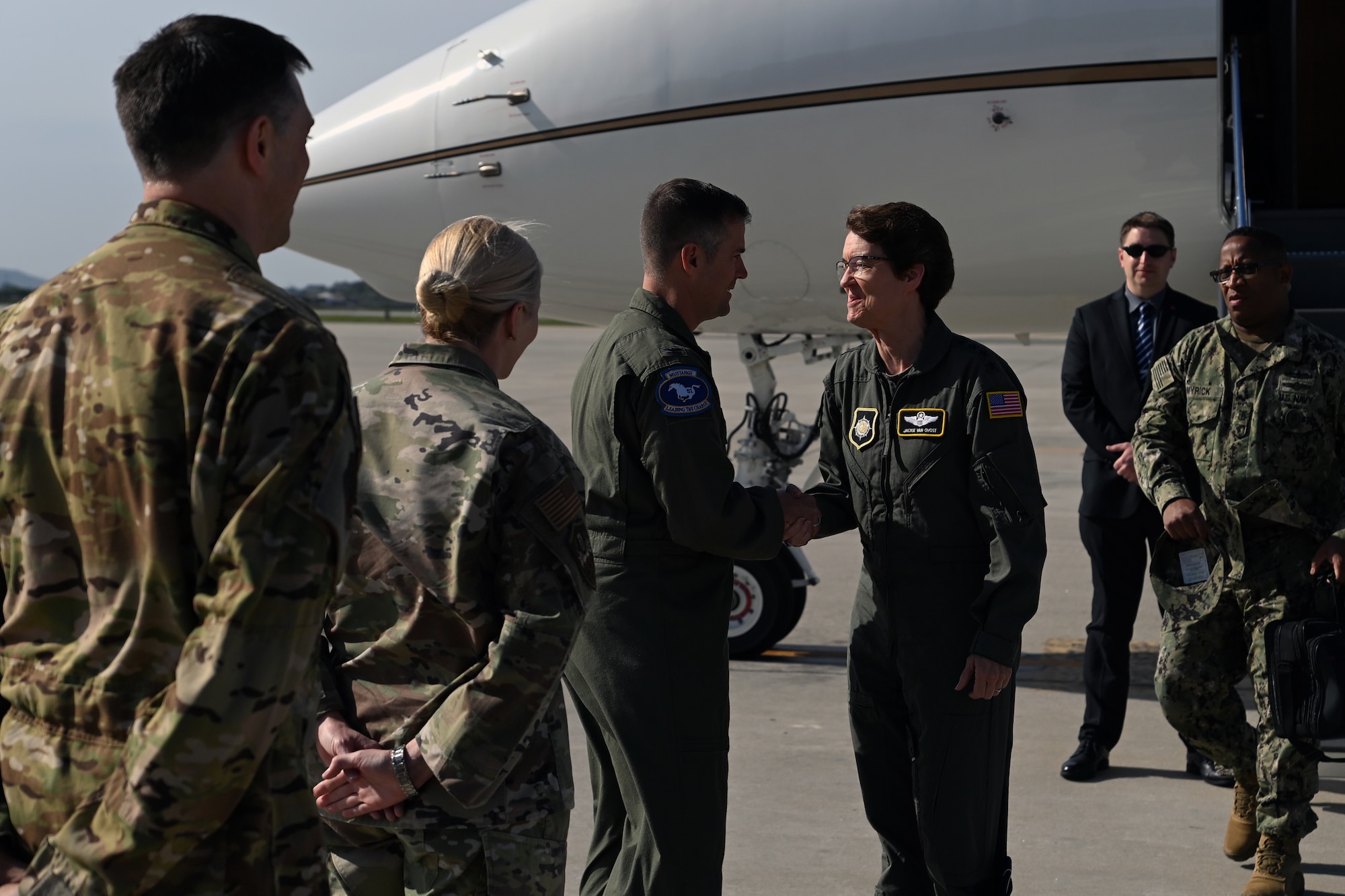 U.S. Air Force Gen. Jacqueline D. Van Ovost, commander, U.S. Transportation Command (USTRANSCOM), greets Col. Joshua Wood, 51st Fighter Wing commander, May 14, 2022, on Osan Air Base, Republic of Korea. USTRANSCOM conducts globally integrated mobility operations, leads the broader Joint Deployment and Distribution Enterprise, and provides enabling capabilities in order to project and sustain the Joint Force in support of national objectives. (U.S. Air Force photo by Master Sgt. Rachelle Morris)