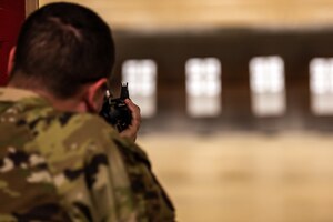 Staff Sgt. William Marshall, 51st Logistics Readiness Squadron fuels lab supervisor, lines up his shot during the M4 rifle portion of the excellence in competition event