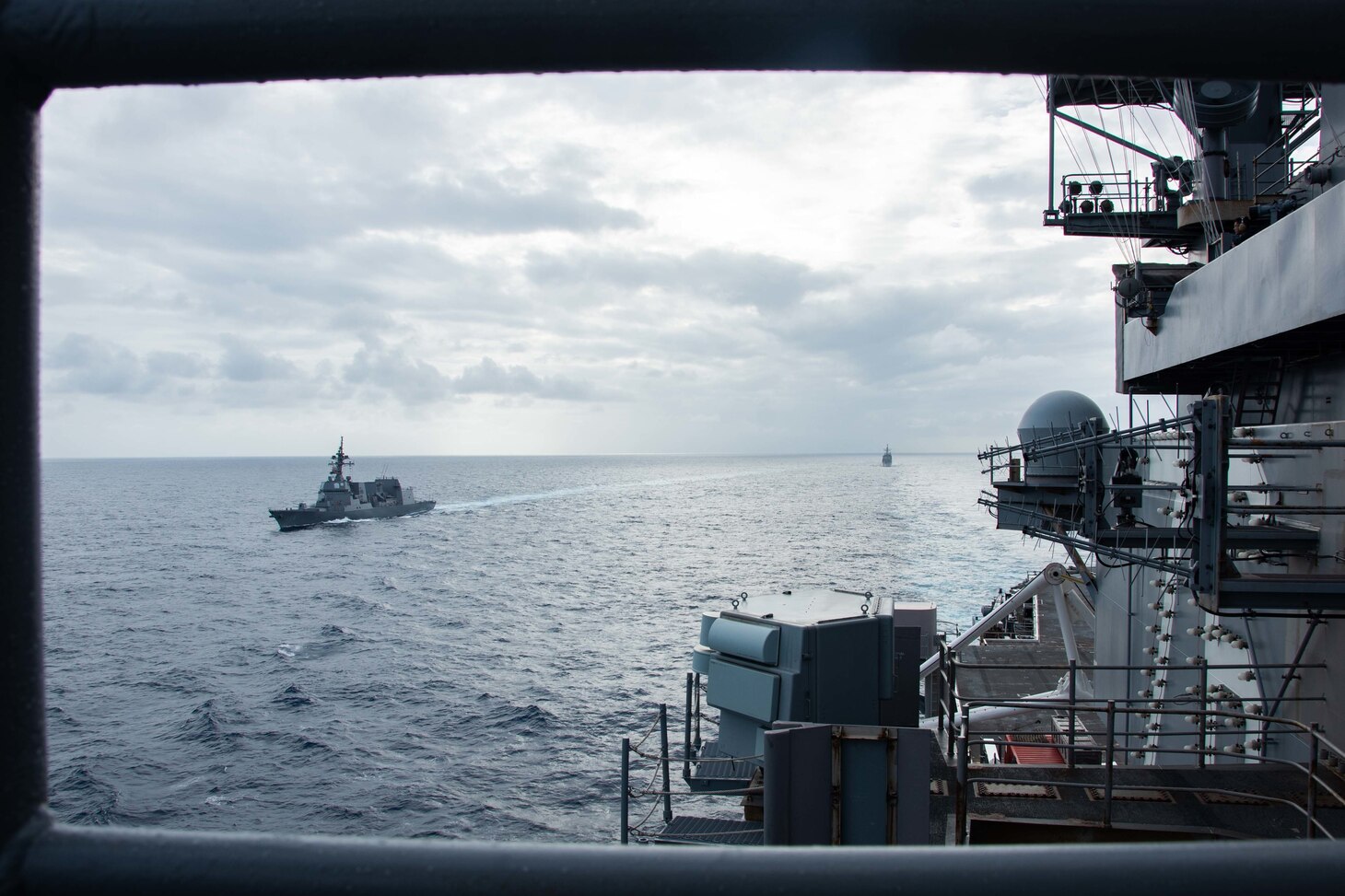 220512-N-BR419-2122 PHILIPPINE SEA (May 12, 2022) Japan Maritime Self-Defense Force (JMSDF) destroyer JS Teruzuki (DD-116), front, and Ticonderoga-class guided-missile cruiser USS Antietam (CG 54) steam in formation with the U.S. Navy’s only forward-deployed aircraft carrier USS Ronald Reagan (CVN 76), during a bilateral exercise. The U.S. Navy and JMSDF routinely conduct naval exercises together, strengthening the U.S.-Japan alliance and maintaining a free and open Indo-Pacific region. Ronald Reagan, the flagship of Carrier Strike Group 5, provides a combat-ready force that protects and defends the United States, and supports alliances, partnerships and collective maritime interests in the Indo-Pacific region. (U.S. Navy photo by Mass Communication Specialist 3rd Class Oswald Felix Jr.)