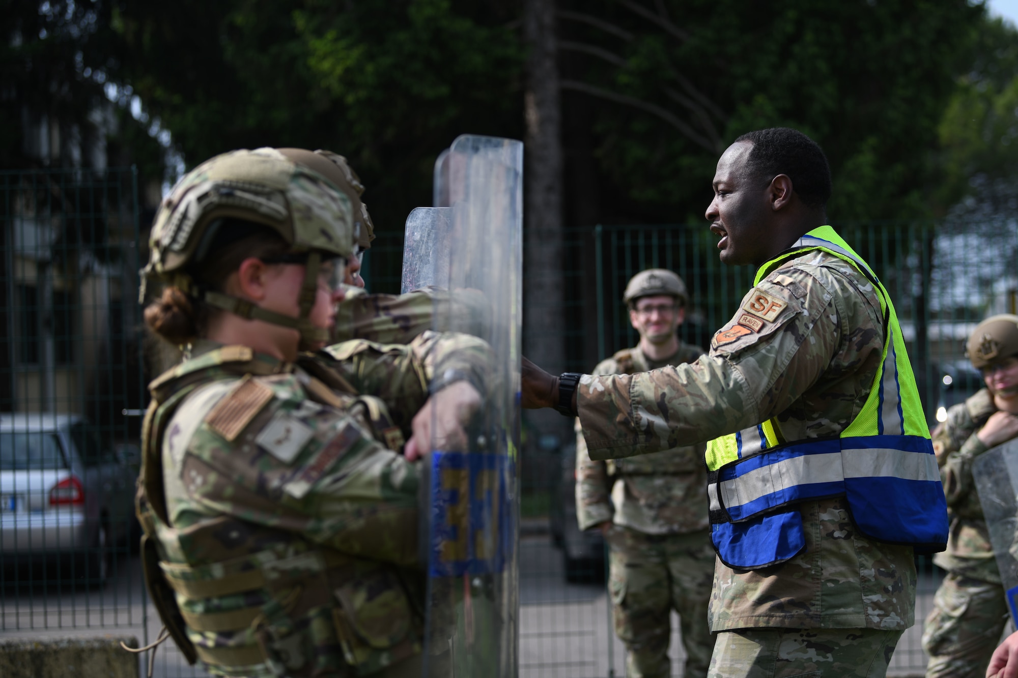 U.S. Air Force Tech. Sgt. Brandon H. Carpenter, 31st Security Forces Squadron member, trains Airmen on riot control tactics during Police Week at Aviano Air Base, Italy, May 16, 2022. Police Week recognizes the service and sacrifice of U.S. law enforcement members, paying special tribute to those who have lost their lives in the line of duty for the safety and protection of others. (U.S. Air Force photo by Senior Airman Ericka A. Woolever)