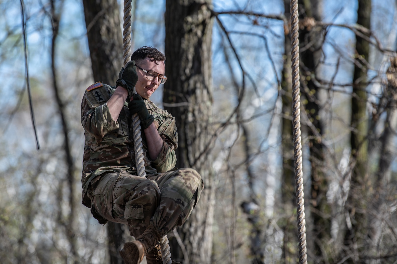 Sgt. Josiah Bell of Rochester, Minnesota, an infantryman with the Wisconsin National Guard’s B Company, 1st Battalion, 128th Infantry Regiment, scales a rope in the obstacle course event during the Region IV Best Warrior Competition at Camp Ripley, Minnesota, May 13, 2022. The annual competition tests the military skills, physical strength and endurance of the top Soldiers and noncommissioned officers from the Minnesota, Wisconsin, Iowa, Illinois, Michigan, Indiana, and Ohio National Guard.