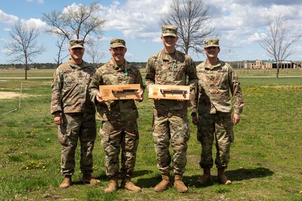 The winners of the Region IV Best Warrior Competition, Spc. Nathaniel Miska and Sgt. Richard Carlson, both with the Minnesota National Guard, with their sponsors at Camp Ripley, Minnesota. The winners move on to compete in the finals July 20-30, 2022, at Camp Smyrna, Tennessee.