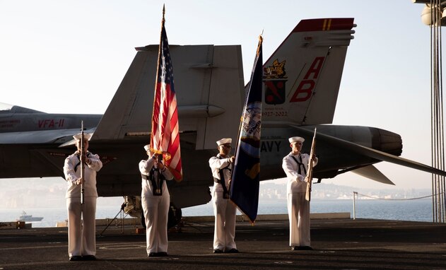 220511-N-QI593-1234 NAPLES, Italy (May 11, 2022) The ceremonial honor guard renders honors, as part of a reception aboard the Nimitz-class aircraft carrier USS Harry S. Truman (CVN 75) during a scheduled port visit, May 11, 2022. The Harry S. Truman Carrier Strike Group is on a scheduled deployment in the U.S. Naval Forces Europe-Africa area of responsibility in support of maritime stability and security, and defense of U.S., Allied and partner interests in Europe and Africa. (U.S. Navy photo by Mass Communication Specialist 3rd Class Alexia Morelos)