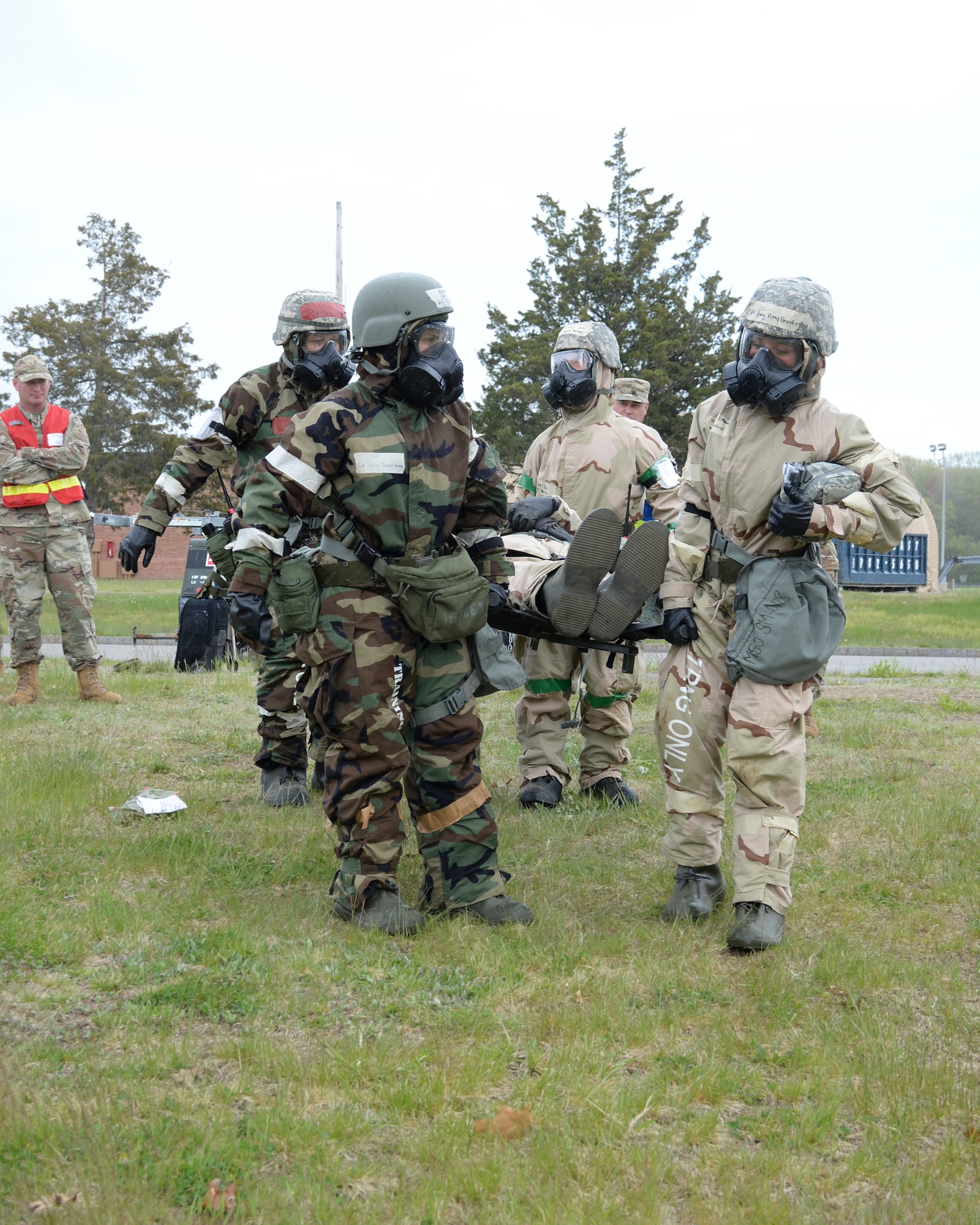 Airmen with the 157th Air Refueling Wing, New Hampshire Air National Guard, perform a litter carry as part of a four-day military readiness exercise at Pease Air National Guard Base, Newington, N.H., May 12-15. The exercise tested the wing's ability to deploy and operate in a contested environment.