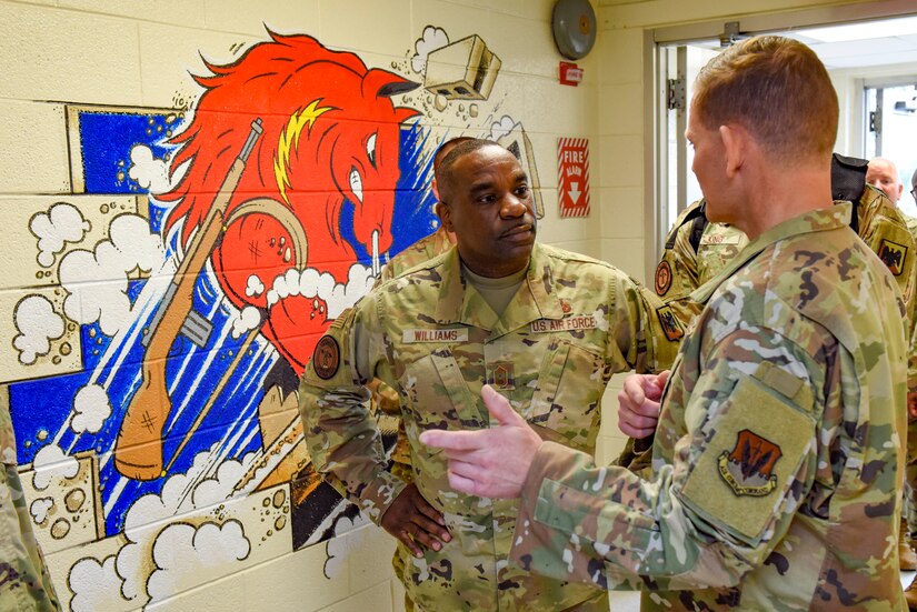 U.S. Air Force Chief Master Sgt. Maurice L. Williams, command chief, Air National Guard, speaks with Chief Master Sgt. John Heidrick, the senior enlisted leader, Detachment 1, 201st Rapid Engineer Deployable Heavy Operational Repair Squadron Engineer, 111th Attack Wing, Pennsylvania National Guard, during a visit to Biddle Air National Guard Base in Horsham, Pennsylvania, on May 14, 2022. Williams spoke with Airmen and discussed the national defense strategy during his visit.