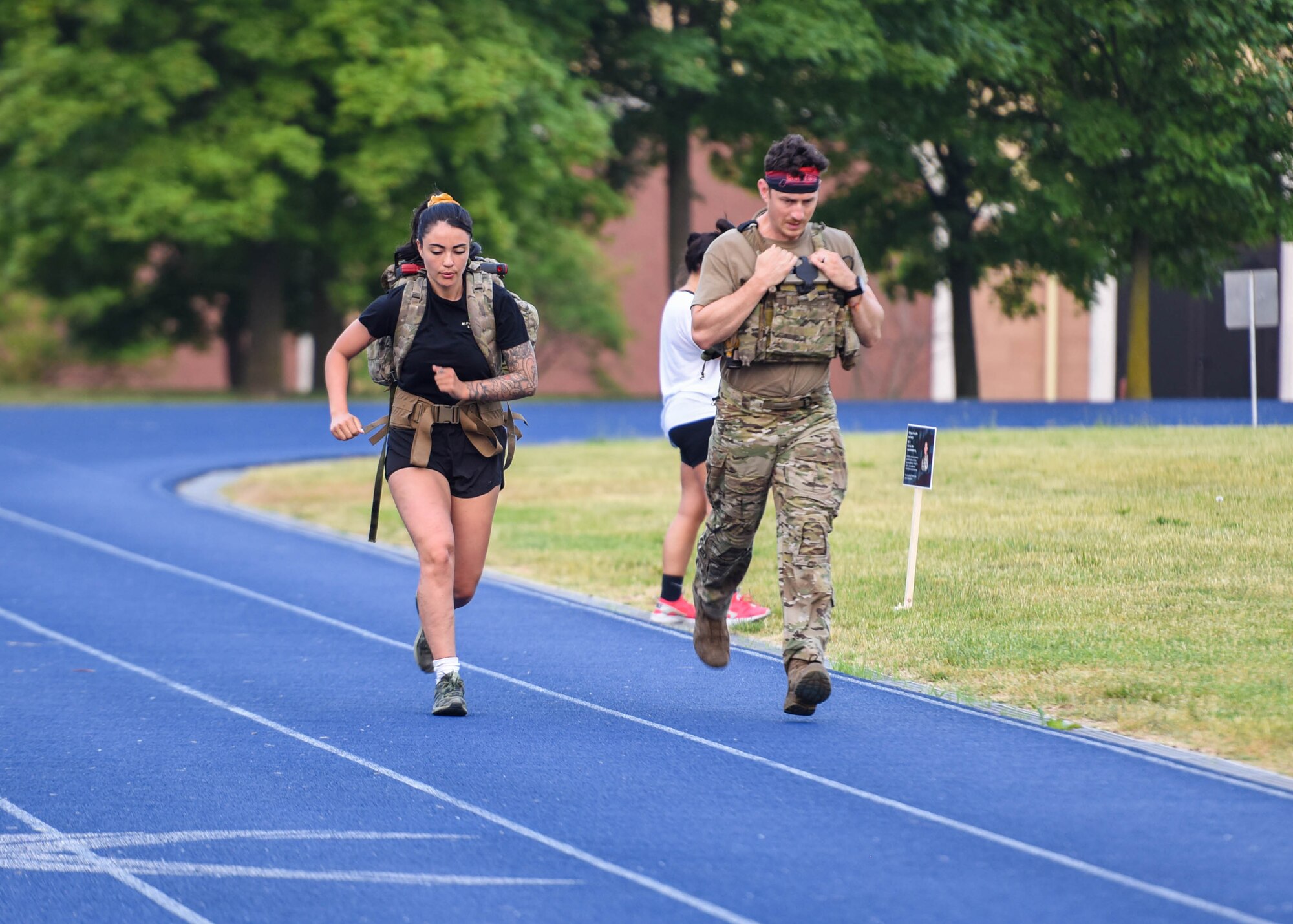 U.S. Air Force Airmen assigned to the 31st Fighter Wing run during a Police Week 15-hour memorial ruck march at Aviano Air Base, Italy, May 16, 2022. Various participants rucked, walked or ran to honor 15 fallen Defenders for 15 hours. The ruck started May 15 at 5 p.m. and ended May 16 at 8 a.m. Police Week recognizes the service and sacrifice of U.S. law enforcement members, paying special tribute to those who have lost their lives in the line of duty for the safety and protection of others.  (U.S. Air Force photo by Senior Airman Brooke Moeder)