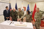 Deputy Secretary of Veterans and Defense Affairs Jason Pak presents Maj. Gen. Timothy P. Williams, the Adjutant General of Virginia, with the Governor of Virginia's 415th Birthday of the Virginia National Guard Proclamation May 13, 2022, at the Sergeant Bob Slaughter Headquarters at Defense Supply Center Richmond, Virginia. The VNG traces the heritage and traditions of citizen-service to the 1607 founding of America’s first permanent English colony at Jamestown when Capt. John Smith organized the colonists for defense. There has not been a day since May 14, 1607, without a military presence in Virginia to defend freedom at home and overseas. Read the full proclamation at https://go.usa.gov/xuFbn.