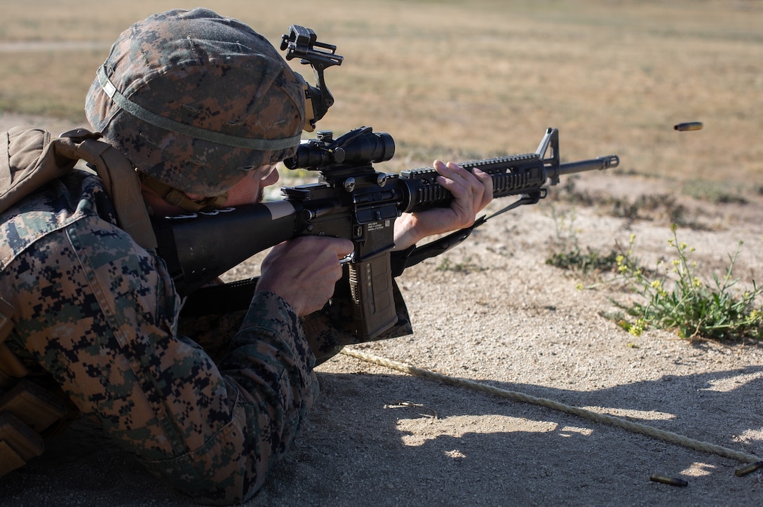 U.S. Marine Lance Cpl. Bailey Amey, a bulk fuel specialist with Bulk Fuel Company, 7th Engineer Support Battalion, 1st Marine Logistics Group, fires his M16A4 service rifle during his annual rifle qualification at Range 116A on Marine Corps Base Camp Pendleton, California, May 11, 2022. Camp Pendleton’s Marksmanship Training Division trains 22,000 Marines and sailors each year across the installation to effectively engage targets with both rifles and pistols. The ARQ is a timed course of fire, ranging from 500 yards down to 15 yards. Amey is a native of Brisbane, Australia. (U.S. Marine Corps photo by Cpl. Benjamin Whitehurst)